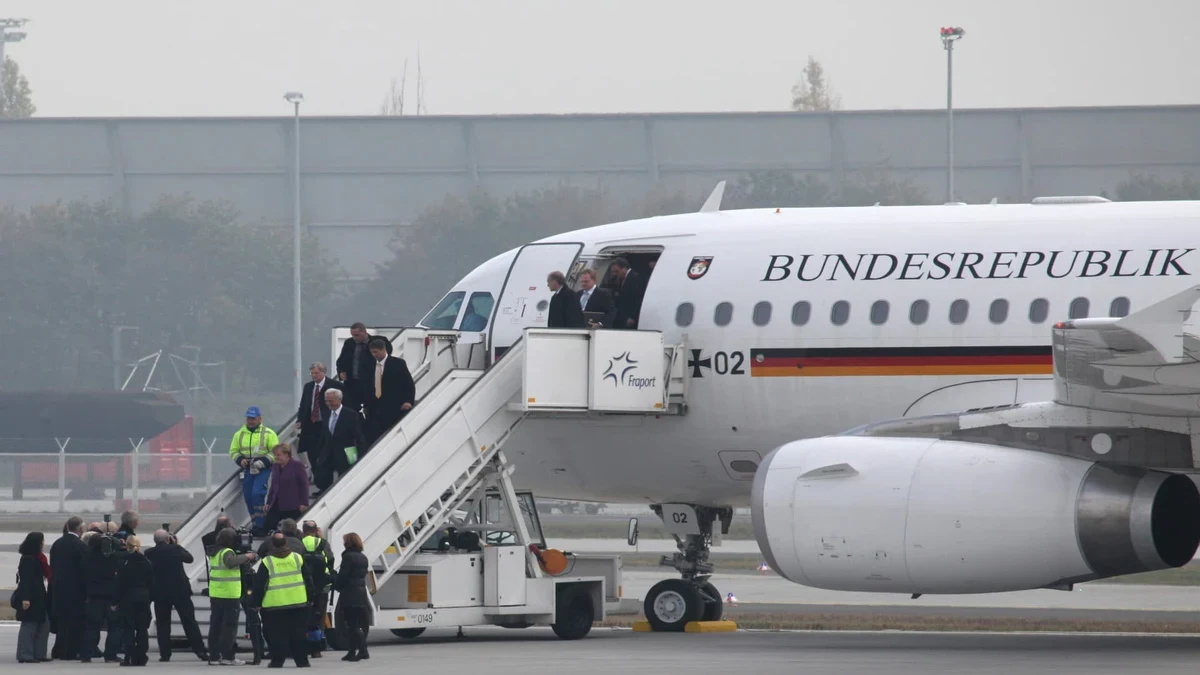 File photo: Germany probes breach after half-naked man boards Merkel's jet