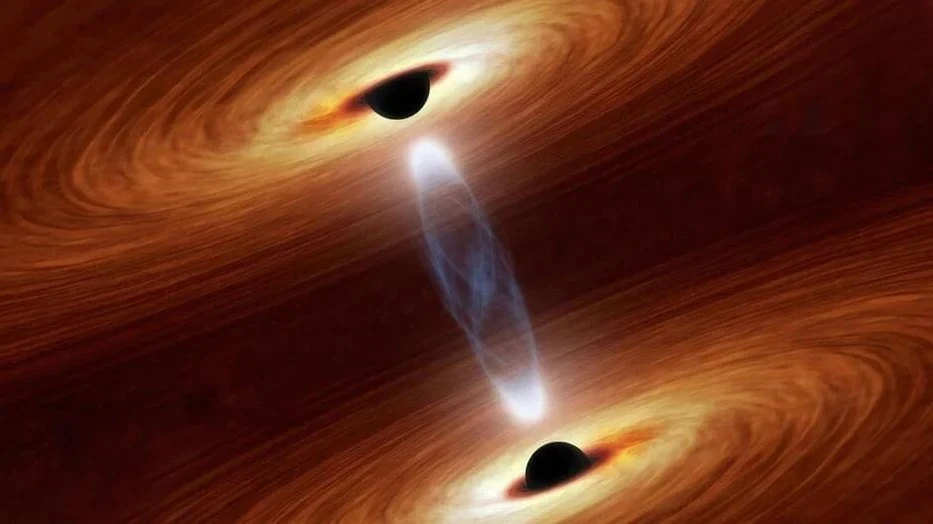 File photo: Two Supermassive Black Holes Set To Collide Will Distort Space And Ti…